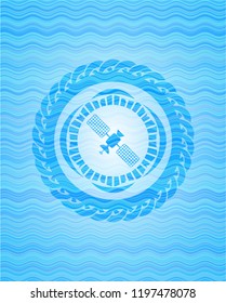 satelite icon inside water concept emblem.