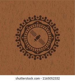 satelite icon inside wood emblem