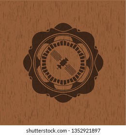 satelite icon inside wood emblem