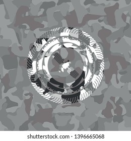 satelite icon on grey camouflage texture