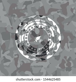 satelite icon on grey camouflaged texture