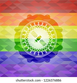 satelite icon on mosaic background with the colors of the LGBT flag