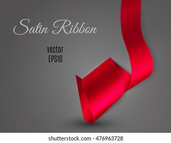 Satin ribbon curl on light grey background and free space for your text