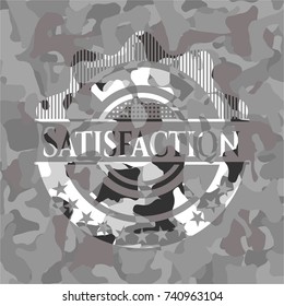 Satisfaction written on a grey camouflage texture