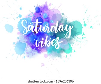 Saturday vibes - handwritten modern calligraphy lettering text on abstract watercolor paint splash background.