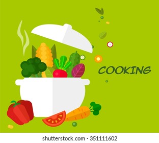 Saucepan with vegetables on the green background. cooking