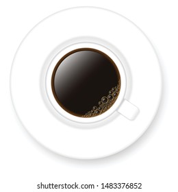 Saucer and white mug with black coffee.Top view.