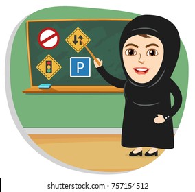 Saudi Arab Women are now allowed to drive in Saudi Arabia. Woman teaching traffic rules and signals in female driving license course. 