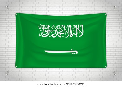 Saudi Arabia flag hanging on brick wall. 3D drawing. Flag attached to the wall. Neatly drawing in groups on separate layers for easy editing.