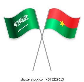 Saudi Arabian and Burkinabe crossed flags. Saudi Arabia combined with Burkina Faso isolated on white. Language learning, international business or travel concept.