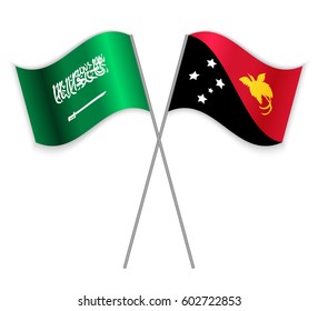 Saudi Arabian and Papuan crossed flags. Saudi Arabia combined with Papua New Guinea isolated on white. Language learning, international business or travel concept.