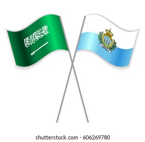 Saudi Arabian and Sammarinese crossed flags. Saudi Arabia combined with San Marino isolated on white. Language learning, international business or travel concept.