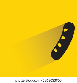 sausage with shadow on yellow background
