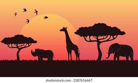 savanna landscape at the sunset. trees and animals silhouettes and vivid sky