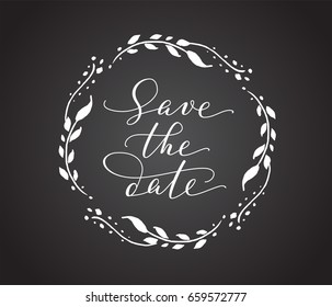 Save the date card with floral wreath. Chalk board style black and white wedding invitation template. Hand written custom calligraphy.