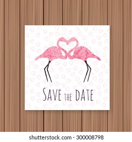 Save the Date card on a wooden background. Can be used for invitations.