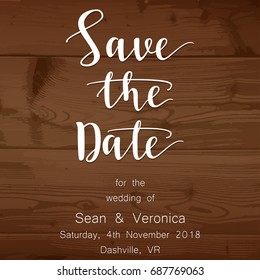 Save the date card, wedding invitation on a wooden background and letters "Save The Date"