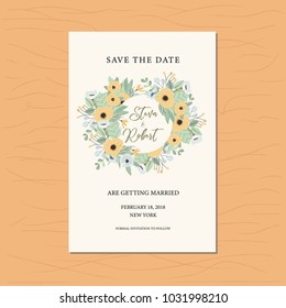 save the date card with yellow floral arrangement.