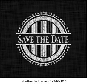 Save the Date chalkboard emblem written on a blackboard