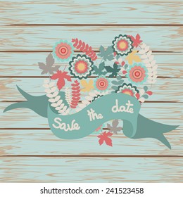 Save the date floral card on wooden background. Cute retro flowers arranged un a shape of the heart perfect for wedding invitations and birthday cards. Vector illustration