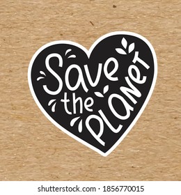 Save the planet - hand written sing with heart simbol on kraft paper. Vector stock illustration isolated on chalkboard background for print on T-shirt, sticker, banner.