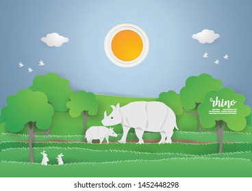 Save World and environment day 
 with  RHINO in the  green forest on  Nature,animals,wildlife background style paper craft vector and illustration 