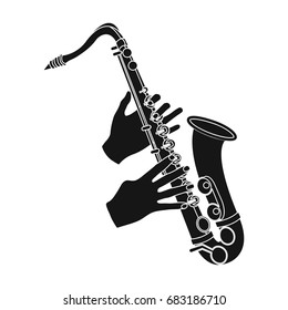 The saxophonist plays the saxophone. Golden saxophone single icon in black style vector symbol stock illustration web.