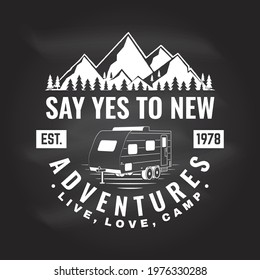 Say yes to new adventure. Live, love, camp Vector on the chalkboard Concept for shirt or logo, print, stamp or tee. Vintage typography design with camper trailer and mountain silhouette Camping quote