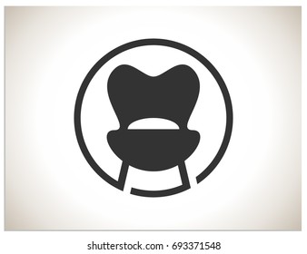 Scalable vector illustration, that consists of stylized minimalist chair or armchair in a circle, created with simple shapes. Isolated logo, which you can use to screen and print