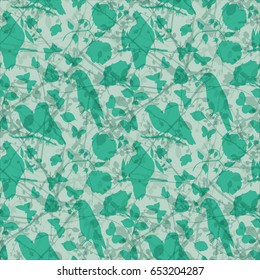 A scalable vector pattern with teal and green silhouettes of birds, butterflies, tree branches, and flowers