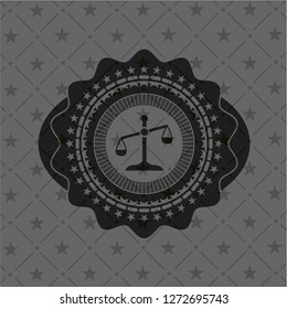 scale icon inside black emblem
