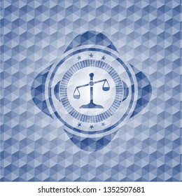 scale icon inside blue emblem or badge with abstract geometric pattern background.