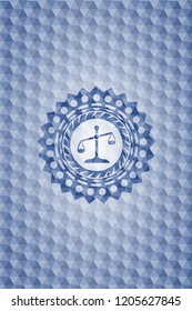 scale icon inside blue hexagon emblem.