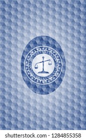 scale icon inside blue polygonal emblem.