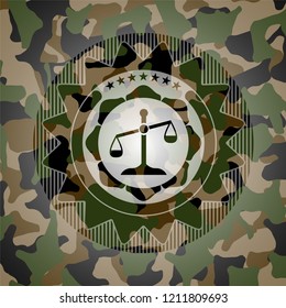 scale icon inside camouflage emblem