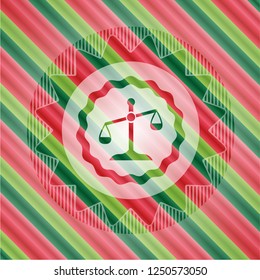 scale icon inside christmas emblem.