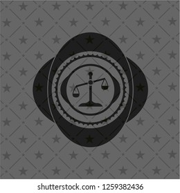 scale icon inside dark emblem