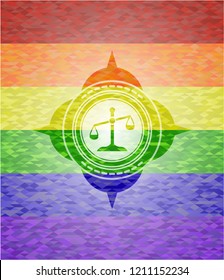 scale icon inside emblem on mosaic background with the colors of the LGBT flag