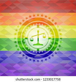 scale icon inside emblem on mosaic background with the colors of the LGBT flag