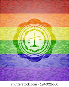 scale icon inside emblem on mosaic background with the colors of the LGBT flag