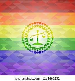 scale icon inside emblem on mosaic background with the colors of the LGBT flag