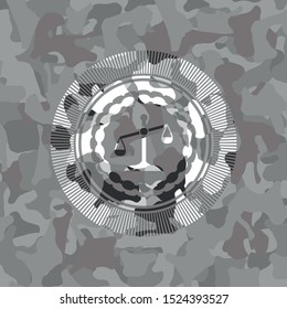 scale icon inside grey camo emblem