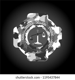 scale icon inside grey camouflaged emblem