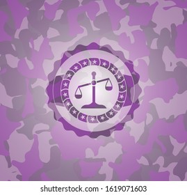 scale icon inside pink and purple camouflage emblem