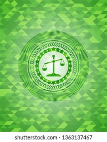scale icon inside realistic green mosaic emblem