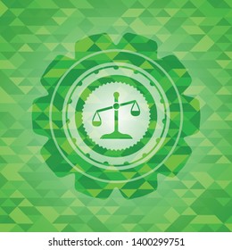 scale icon inside realistic green emblem. Mosaic background