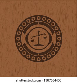 scale icon inside retro style wood emblem