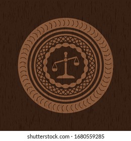 scale icon inside retro wooden emblem