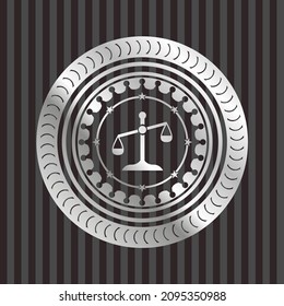 scale icon inside silver emblem or badge. 