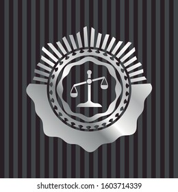 scale icon inside silvery emblem or badge